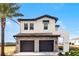 Beautiful two-story home featuring a stone-accented two car garage, brick-paved driveway, and tile roof at 16028 Trivoli Cir, Montverde, FL 34756
