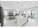 Open floor plan combines the kitchen and living area with seamless access to outdoor spaces at 16028 Trivoli Cir, Montverde, FL 34756