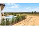 Backyard pool featuring brick surround and a distant view of a green landscape at 16028 Trivoli Cir, Montverde, FL 34756