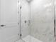 Contemporary shower with seamless glass door and elegant tiling for a luxurious bathing experience at 16028 Trivoli Cir, Montverde, FL 34756