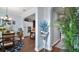 Transitional dining area with blue and white decor, tile flooring, and blue floral arrangement at 17066 Se 111Th Ter, Summerfield, FL 34491