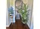 Hallway featuring wood floors with an open view and decor at 17066 Se 111Th Ter, Summerfield, FL 34491