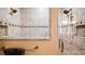 A close-up view of a tiled shower with built-in shower caddy at 17066 Se 111Th Ter, Summerfield, FL 34491