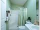 Bathroom featuring a walk-in shower, a white vanity and fresh green paint at 1723 Morelos Rd, The Villages, FL 32159