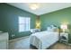 Bright bedroom with a bed, white furniture, and a view from the window at 1723 Morelos Rd, The Villages, FL 32159