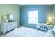 Comfortable bedroom featuring a decorative dresser, providing ample storage space and a cozy ambiance at 1723 Morelos Rd, The Villages, FL 32159