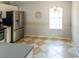 Bright dining area featuring neutral walls, tile flooring and a decorative chandelier at 1723 Morelos Rd, The Villages, FL 32159