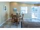 Cozy dining room with a round table, tile floors, and natural light from the window at 1723 Morelos Rd, The Villages, FL 32159