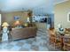 Open concept living space flowing into the kitchen, perfect for entertaining with stylish decor and ample seating at 1723 Morelos Rd, The Villages, FL 32159