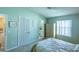 Bright main bedroom with large closet and ensuite bathroom access, plush carpeting, and soothing paint at 1723 Morelos Rd, The Villages, FL 32159