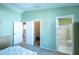Airy main bedroom featuring a walk-in closet, ensuite bathroom and neutral carpet at 1723 Morelos Rd, The Villages, FL 32159
