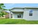 The backyard features a covered patio area perfect for outdoor entertaining and relaxation at 179 Bottle Brush Dr, Haines City, FL 33844