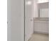 Bathroom featuring granite countertops, white cabinets, and tiled floors at 179 Bottle Brush Dr, Haines City, FL 33844