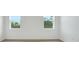 Bright bedroom with two windows providing natural light and neutral carpet at 179 Bottle Brush Dr, Haines City, FL 33844