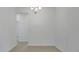 Empty dining room featuring a modern chandelier and lots of space at 179 Bottle Brush Dr, Haines City, FL 33844