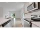 Beautiful kitchen with stainless steel appliances, white cabinets, and a modern design at 179 Bottle Brush Dr, Haines City, FL 33844