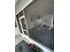 Relaxing screened porch featuring comfortable seating, natural light, and a peaceful atmosphere at 201 Jacaranda Dr, Leesburg, FL 34748