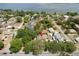 Aerial view of the property showcasing the home and its surrounding landscape at 202 N Palm Ave, Howey In The Hills, FL 34737