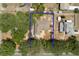 Aerial view of property lines showing the perimeter of the lot in a wooded neighborhood at 202 N Palm Ave, Howey In The Hills, FL 34737