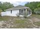 Exterior of house with a fenced in backyard at 202 N Palm Ave, Howey In The Hills, FL 34737