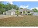 Charming single-story home with a well-manicured front yard and attached two-car garage at 202 N Palm Ave, Howey In The Hills, FL 34737