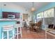 Eat in kitchen featuring tiled floors, a breakfast bar and dining space at 202 N Palm Ave, Howey In The Hills, FL 34737