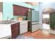 Kitchen showcasing modern appliances, cabinet space and connection to the living room at 202 N Palm Ave, Howey In The Hills, FL 34737