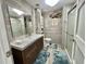 Bathroom with a wood-look vanity, shower, and tub at 207 Hawthorne Blvd, Leesburg, FL 34748