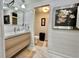 Bathroom sink and vanity with a view to the toilet and shower at 207 Hawthorne Blvd, Leesburg, FL 34748