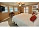 Bedroom with a large bed, side tables, and sliding closet doors at 207 Hawthorne Blvd, Leesburg, FL 34748