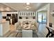 Bright dining area featuring a modern table, stylish chairs, and easy access to the updated kitchen at 207 Hawthorne Blvd, Leesburg, FL 34748