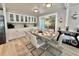 Elegant dining area with a stylish table, modern chairs, and built-in cabinets at 207 Hawthorne Blvd, Leesburg, FL 34748