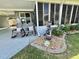 Inviting front porch with rocking chairs and a decorative water fountain feature at 207 Hawthorne Blvd, Leesburg, FL 34748