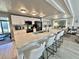 Modern kitchen featuring a large island with seating and sleek, white cabinetry at 207 Hawthorne Blvd, Leesburg, FL 34748