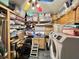 Functional laundry room with washer, dryer, and storage cabinets to keep organized at 207 Hawthorne Blvd, Leesburg, FL 34748