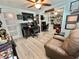 Office features a built-in desk, shelving, and a comfortable leather chair to relax in at 207 Hawthorne Blvd, Leesburg, FL 34748
