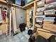 Organized storage room with shelving, cabinets, and various household items neatly arranged on tile flooring at 207 Hawthorne Blvd, Leesburg, FL 34748