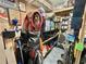 Organized garage storage with various tools, hardware, golf clubs, and household items on shelving at 207 Hawthorne Blvd, Leesburg, FL 34748