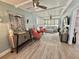 Inviting sunroom features shiplap walls, tongue-and-groove ceiling, and plantation shutters for natural light at 207 Hawthorne Blvd, Leesburg, FL 34748
