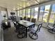 Inviting sunroom with a large table, seating, ceiling fans, and plenty of windows for natural light and outdoor views at 207 Hawthorne Blvd, Leesburg, FL 34748
