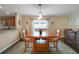 Dining room featuring a wood table with seating for four and stylish decor at 20816 Sullivan Ranch Blvd, Mount Dora, FL 32757