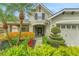 Charming home featuring a two-car garage and beautifully landscaped front yard at 20816 Sullivan Ranch Blvd, Mount Dora, FL 32757