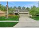 Charming single-Gathering home with a two-car garage, lush landscaping, and a welcoming entryway at 20816 Sullivan Ranch Blvd, Mount Dora, FL 32757