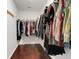 Walk-in closet with hardwood floors and closet system at 20816 Sullivan Ranch Blvd, Mount Dora, FL 32757