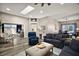 Spacious living room with a vaulted ceiling, wood-look flooring, and lots of natural light at 2142 Margarita Dr, The Villages, FL 32159