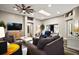 Comfortable living room features a ceiling fan, recessed lighting, and a skylight for ample natural light at 2142 Margarita Dr, The Villages, FL 32159