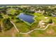 Aerial shot features a scenic water feature and golf course at 23814 Sardinia Dr, Sorrento, FL 32776