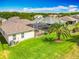Aerial view of a well-maintained backyard with an enclosed patio and lush landscaping at 25545 Laurel Valley Rd, Leesburg, FL 34748