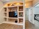 Built-in shelving in the living room provides storage and display space, next to ensuite bathroom and bedroom at 25545 Laurel Valley Rd, Leesburg, FL 34748
