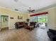 Cozy living room featuring comfortable sofas, a ceiling fan, and natural light at 25545 Laurel Valley Rd, Leesburg, FL 34748